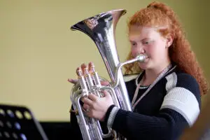 Music student playing tuba
